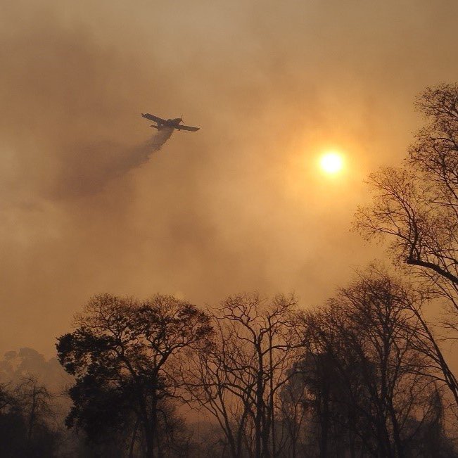 A man pushes a boat to shore in Bali, Indonesia
