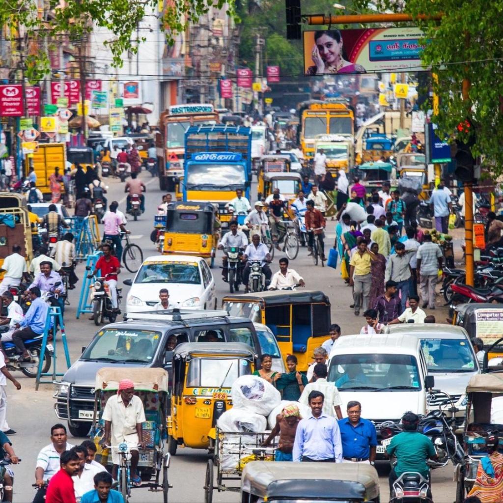 A busy street with cars and people