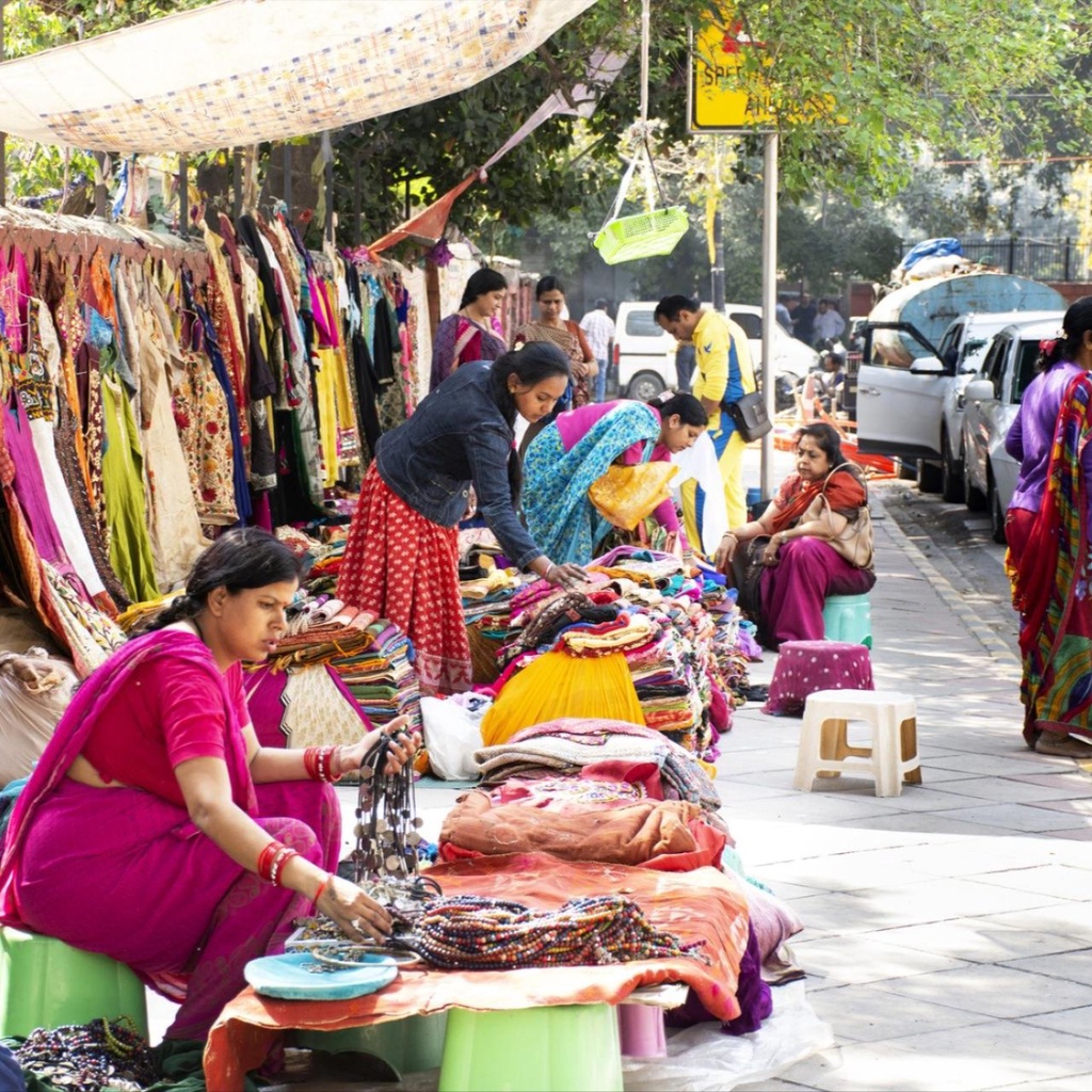 A man pushes a boat to shore in Bali, Indonesia