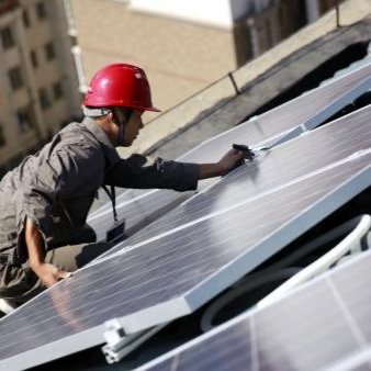 A woman carries water during a blistering hot day in New Delhi, India.