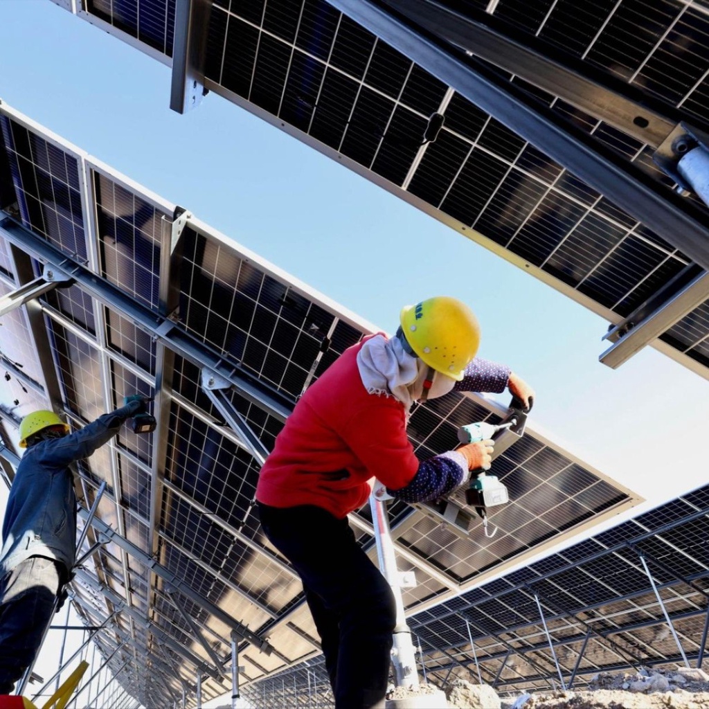 A woman carries water during a blistering hot day in New Delhi, India.